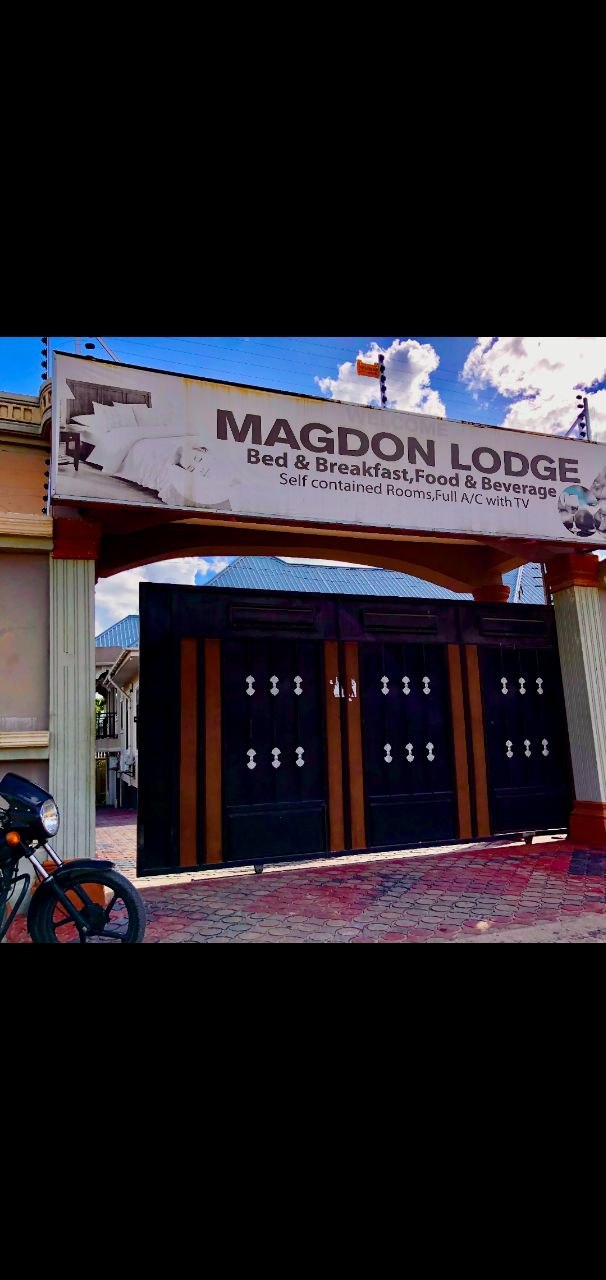 Magdon Lodge entrance gate and signboard