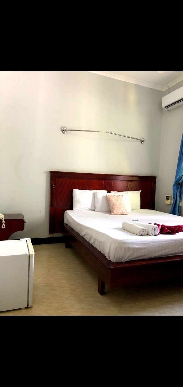 Mahogany king room with mini-fridge and AC